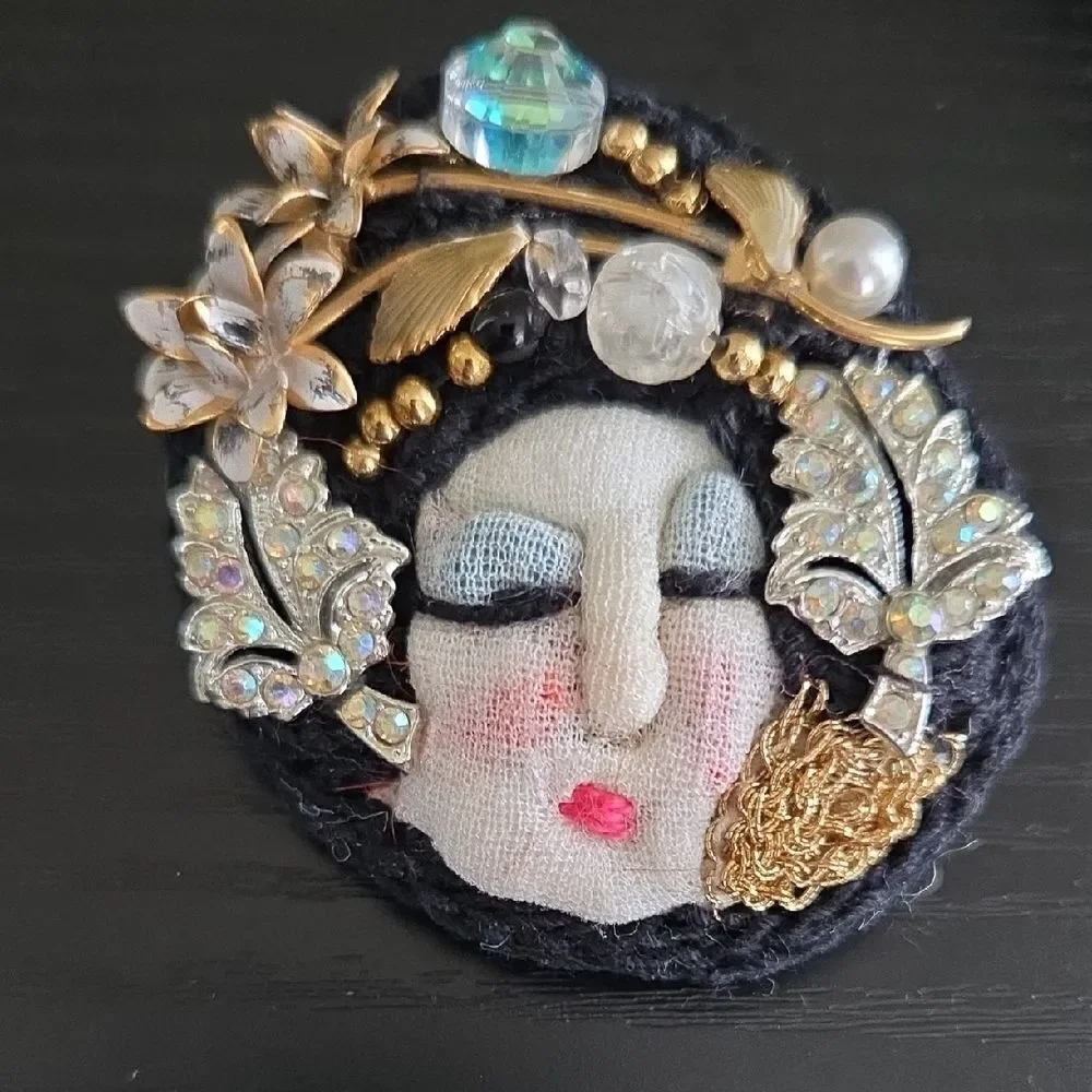 Artistic Face Brooch with Gold and Black Accents